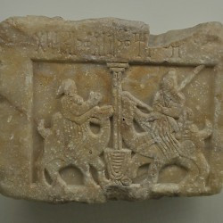 Yemenite relief of a woman and a man, seated on dromedaries, meeting at a well