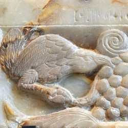 Yemen, Relief of a bird eating grapes
