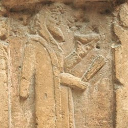 Relief of a magian with libation bowl and barsom