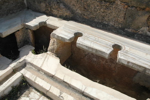 Lepcis Magna, Hadrianic baths, Western toilets (note the sculptor's error)