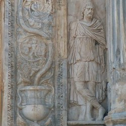 Lepcis, Arch of Septimius Severus, SW, barbarian (left)