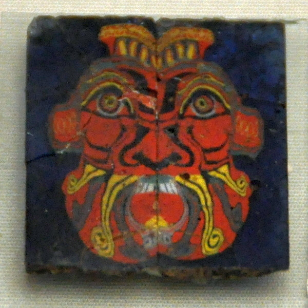 Glass mosaic of a face of Bes
