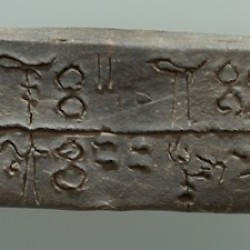 A Linear-B tablet mentioning sheep, goats, oxen, and pigs being brought to a place called Si-ra-ro.