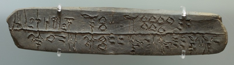 A Linear-B tablet mentioning sheep, goats, oxen, and pigs being brought to a place called Si-ra-ro.