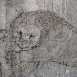 Persepolis, Apadana, East Stairs, Northern part, Lion attacking a bull