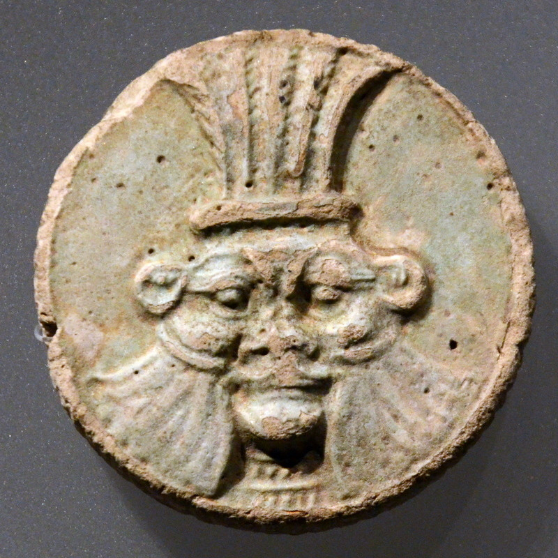 A Hellenistic or Roman disk with the face of Bes