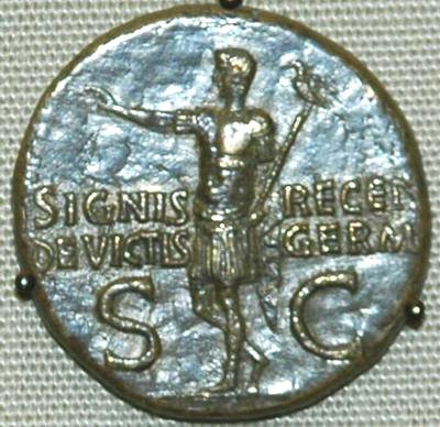 Germanicus returns with the recovered legionary standard (coin by his son Caligula)