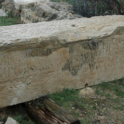 Lepcis, Amphitheater, inscription of Septimius Severus, Caracalla and (erased) Geta