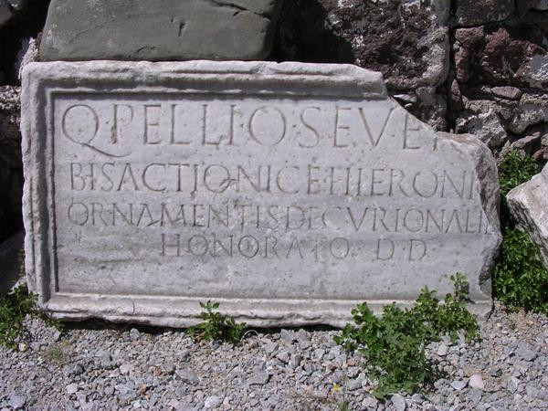 Latin inscription, mentioning a honorary member of the decurional order