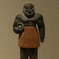Monstrous male figure with a water vessel (Early Bronze Age)