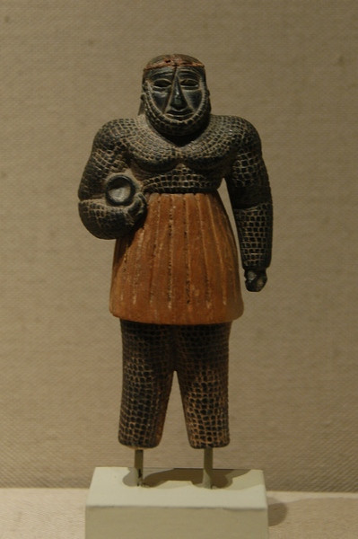 Monstrous male figure with a water vessel (Early Bronze Age)