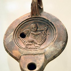 Lepcis Magna, Oil lamp with Eros playing harp