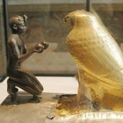 Taharqo venerating the falcon-god Hemen