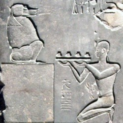 Psammetichus II sacrificing to Thoth, represented as baboon