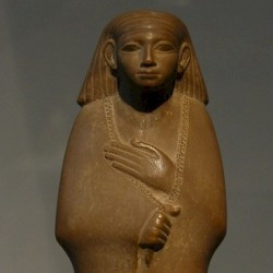 Statuette of a cloaked man