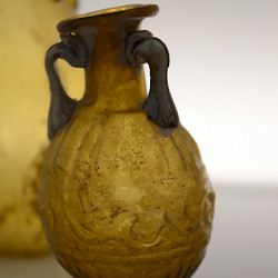 A "Sidonian bottle" of amber-colored glass