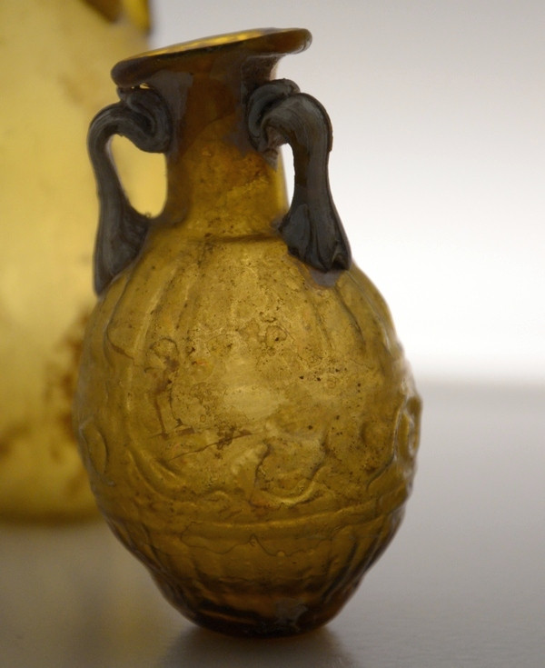 A "Sidonian bottle" of amber-colored glass