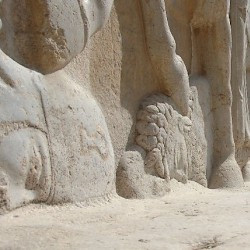 Naqš-e Rustam, Investiture relief of Ardašir I, the defeated Parthian king Artabanus (left) and Ahriman (center)